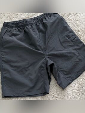 Uniqlo Men's  gray  elastic-waist nylon shorts.